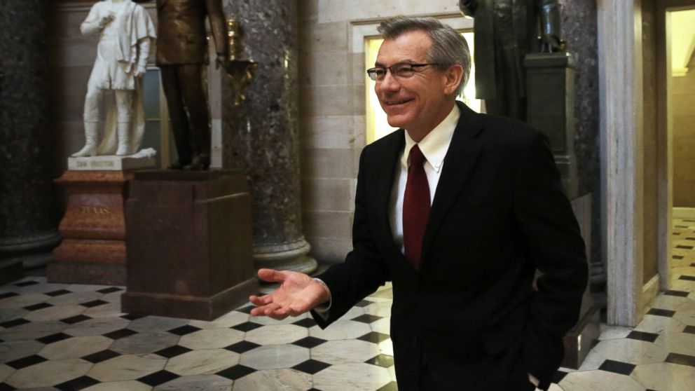 Rep. David Schweikert talks to members of the media as he walks through the Statuary Hall at the Capitol Oct. 11, 2013 on Capitol Hill in Washington, DC. 