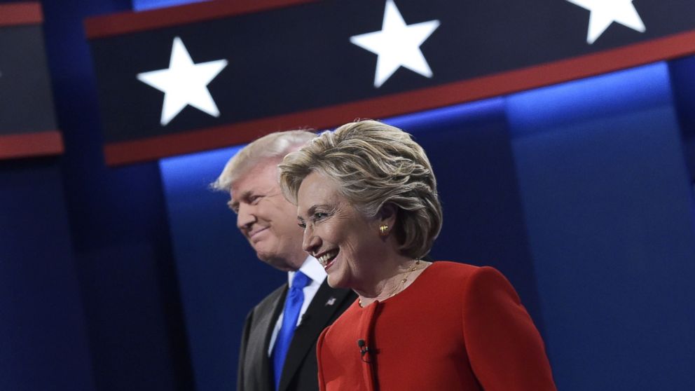 Republican presidential nominee Donald Trump and Democratic presidential nominee Hillary Clinton arrive on stage for the first presidential debate at Hofstra University in Hempstead, New York on Sept. 26, 2016.
