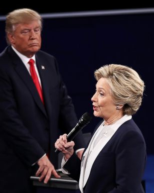 PHOTO: Hillary Clinton speaks as Donald Trump looks on during the town hall debate at Washington University, Oct. 9, 2016, in St Louis.