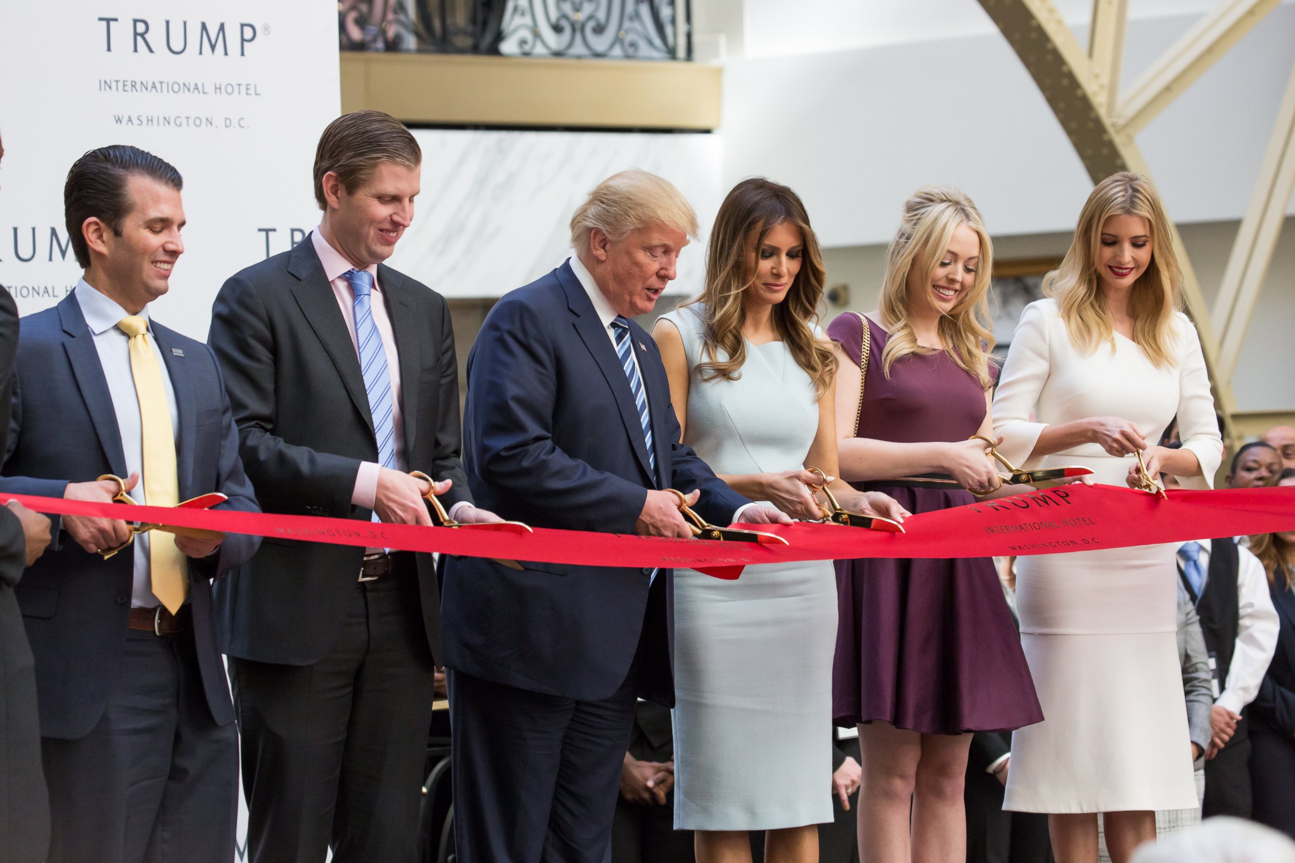 PHOTO: Donald Trump Jr.,  Eric Trump, Donald J. Trump, Melania Trump, Tiffany Trump, and Ivanka Trump, cut the ribbon for their latest property, Trump International Hotel - Old Post Office, in Washington, on Oct. 26, 2016.