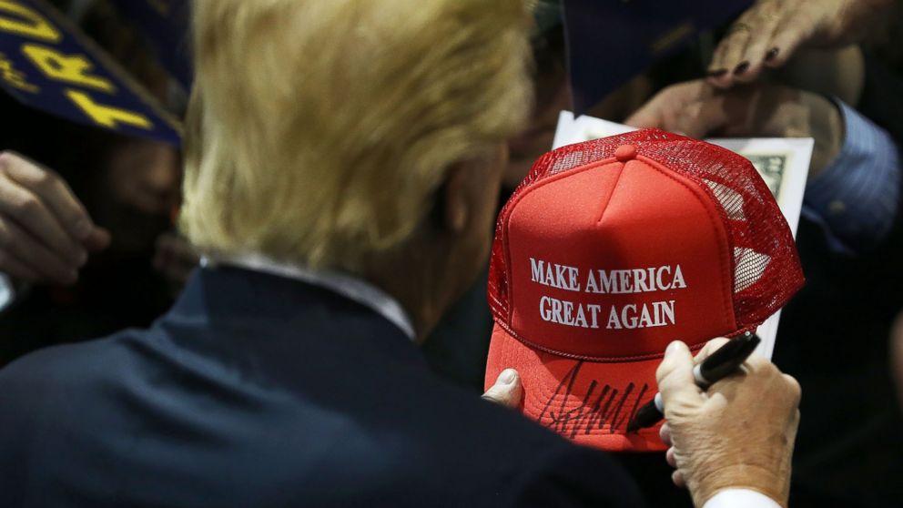 PHOTO:Donald Trump signs one of his campaign hats during a event at the University of Northern Iowa, Jan. 12, 2016, in Cedar Falls, Iowa.  