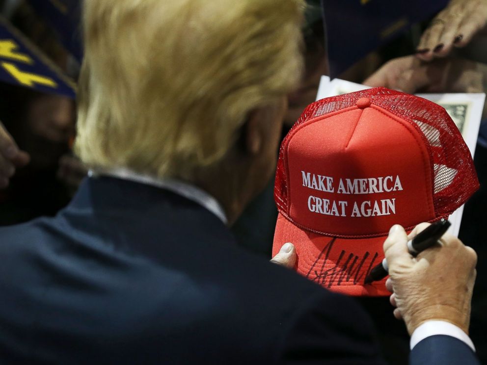 PHOTO:Donald Trump signs one of his campaign hats during a event at the University of Northern Iowa, Jan. 12, 2016, in Cedar Falls, Iowa.  