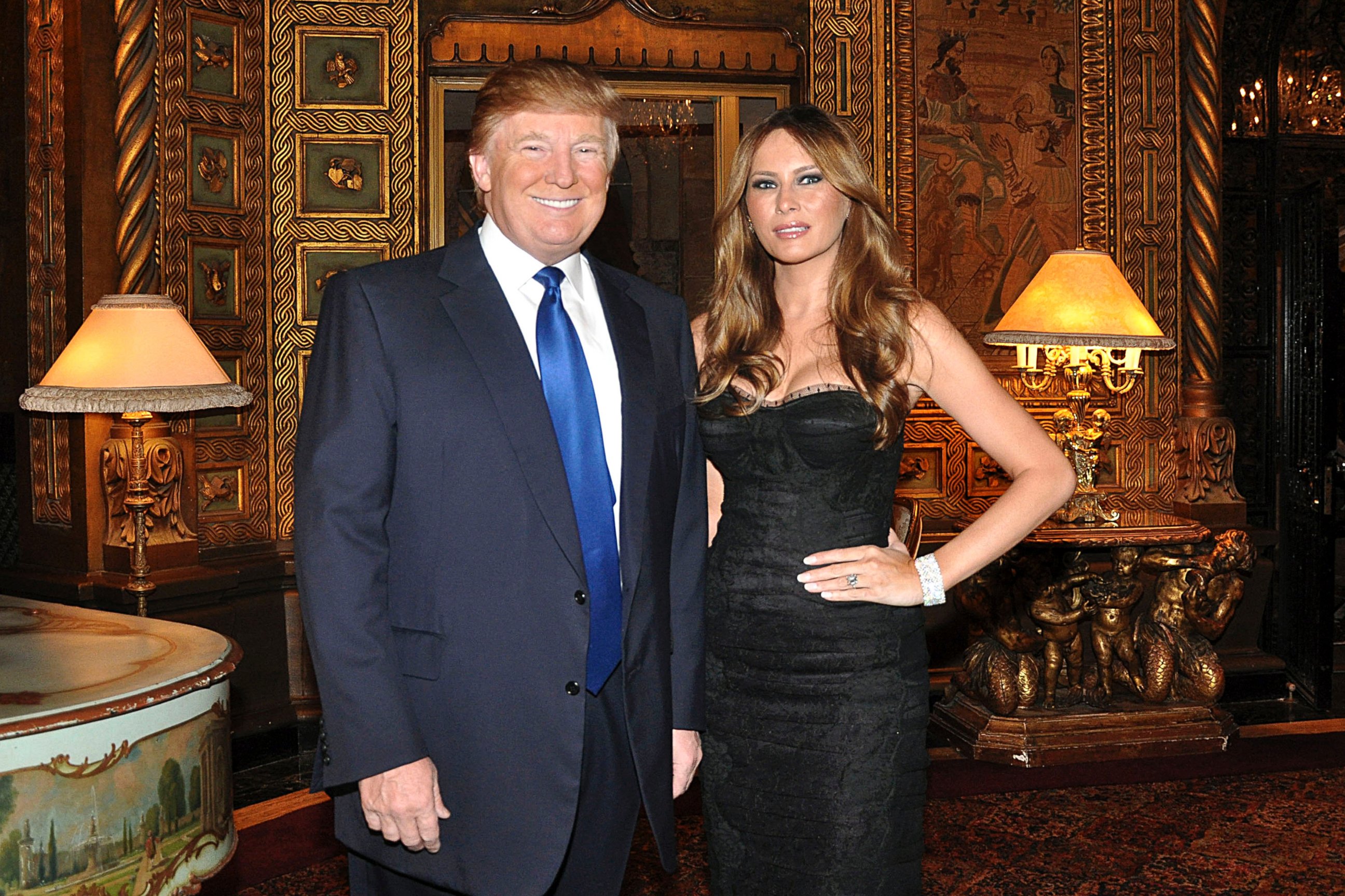 PHOTO: Donald Trump, billionaire real estate developer, left, and his wife Melania Trump stand for a photograph at the Mar-A-Lago Club in Palm Beach, Fla., U.S.,Feb. 19, 2011. 