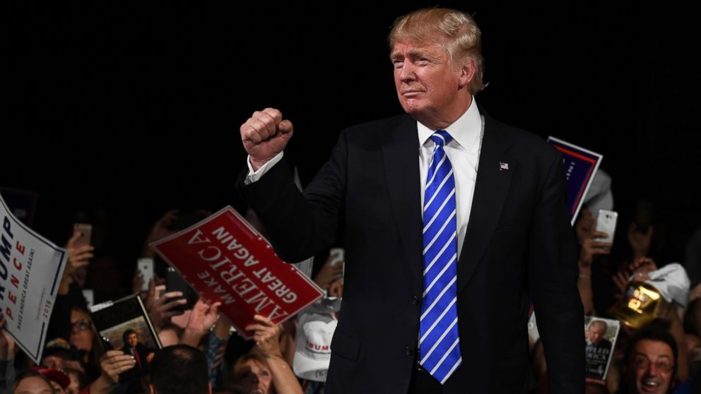 Republican presidential nominee Donald Trump greets supporters during a campaign rally at the Suburban Collection Showplace in Novi, Michigan, Sept. 30, 2016. 