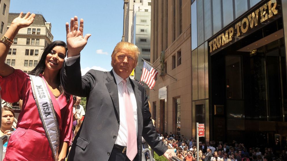 PHOTO: Miss USA Rima Fakih and real estate mogul Donald Trump attend Donald Trump's Gray Line New York's Ride of Fame campaign dedication at front of  Trump Tower, June 8, 2010 in New York.  