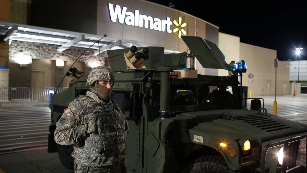 A National Guard troop stands outside of a closed Walmart, Nov. 27, 2014, in Ferguson, Mo.
