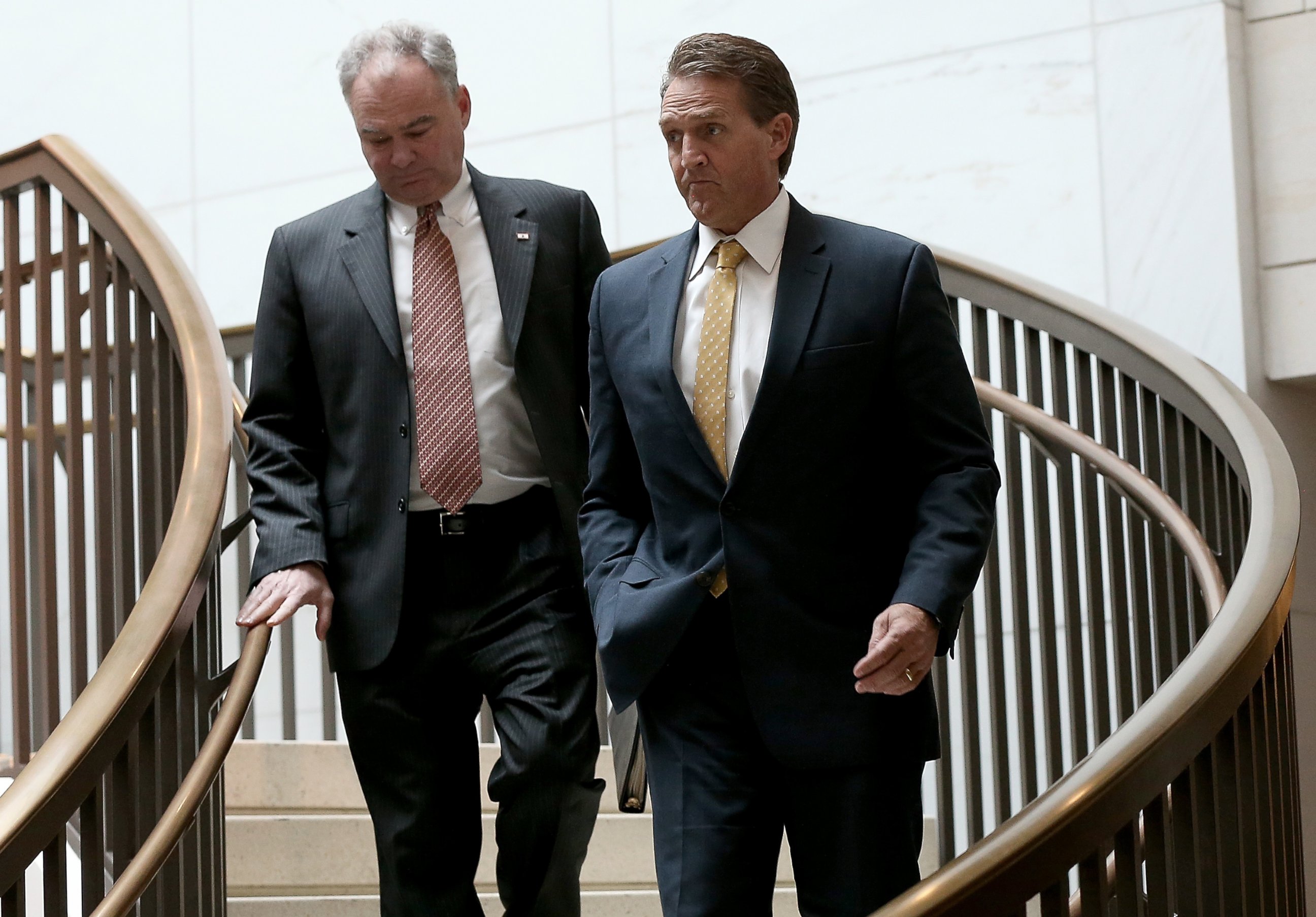 PHOTO: Sen. Jeff Flake and Sen. Tim Kaine walk to a closed briefing given by Brett McGurk, deputy special presidential envoy for the Global Coalition to Counter ISIL, at the U.S. Capitol, Nov. 10, 2015, in Washington.