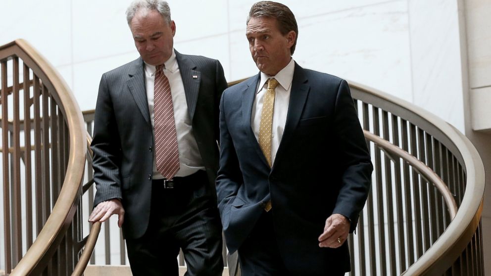 PHOTO: Sen. Jeff Flake and Sen. Tim Kaine walk to a closed briefing given by Brett McGurk, deputy special presidential envoy for the Global Coalition to Counter ISIL, at the U.S. Capitol, Nov. 10, 2015, in Washington.