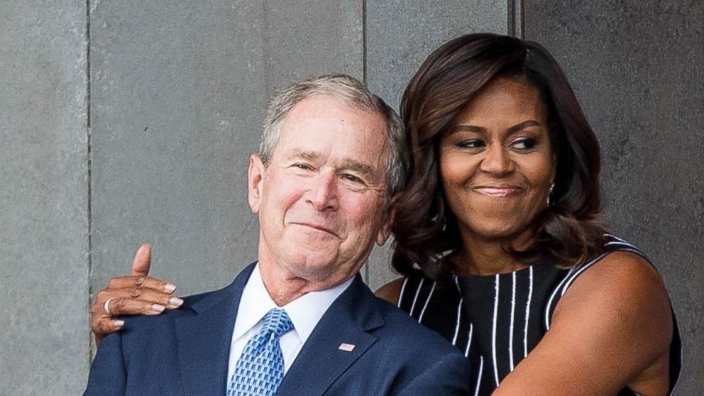 PHOTO: Former President George W. Bush receives a hug from first lady Michelle Obama as they attend the opening ceremony for the Smithsonian National Museum of African American History and Culture, Sept. 24, 2016 in Washington. 