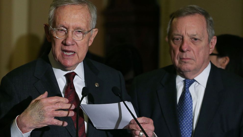 Senate Minority Leader Harry Reid speaks to the media while flanked by Sen. Dick Durbin after attending the weekly Senate Policy Luncheon on Capitol Hill, Jan. 27, 2016, in Washington.