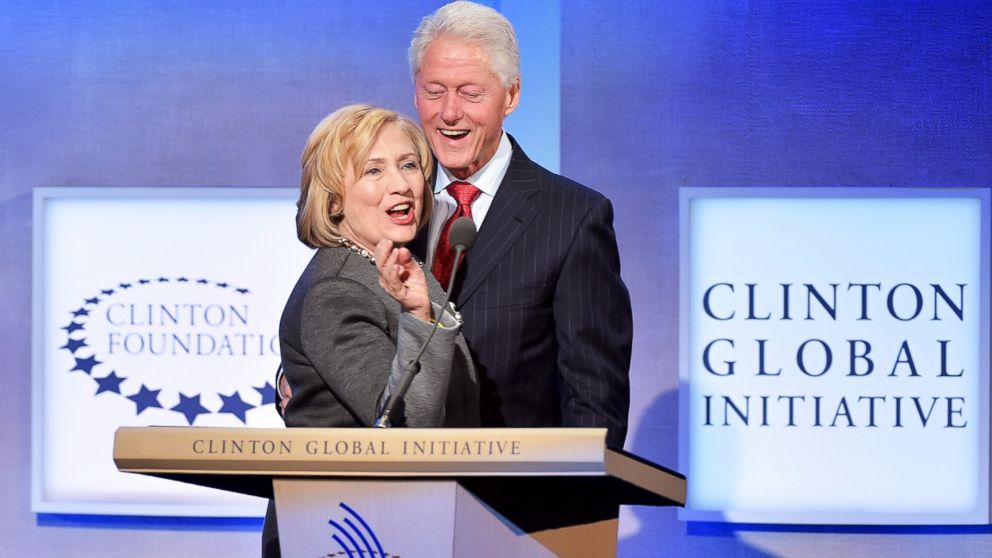 Former US Secretary of State Hillary Clinton and husband, Former U.S. President Bill Clinton address the audience during the Opening Plenary Session: Reimagining Impact for the Clinton Global Initiative, Sept. 22, 2014, in New York City.
