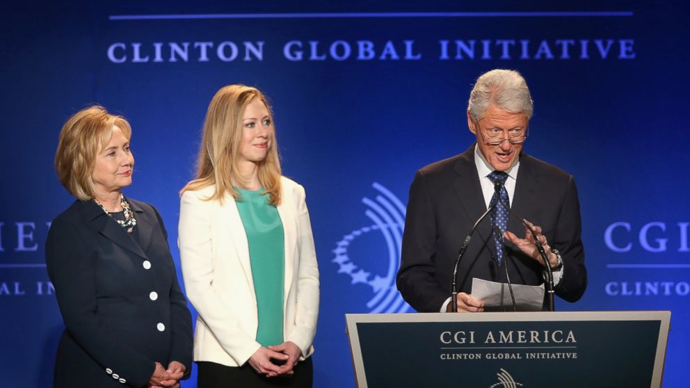 Former President Bill Clinton, his wife Former Secretary of State Hillary Clinton (L) and their daughter Chelsea Clinton speak to guests at the Clinton Global Initiative (CGI) on June 14, 2013 in Chicago.