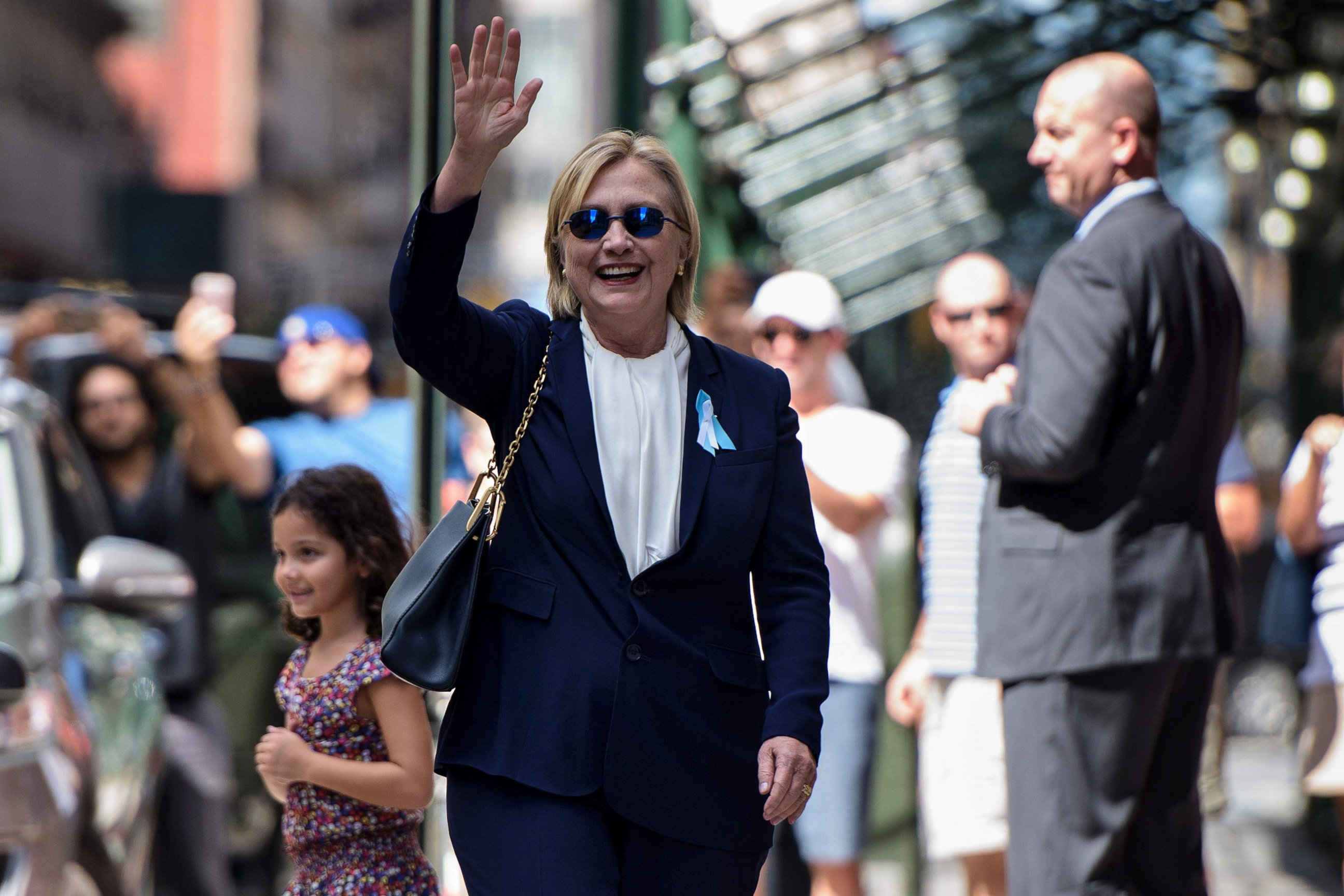 PHOTO: Democratic presidential nominee Hillary Clinton waves to the press as she leaves her daughter's apartment building after resting on Sept. 11, 2016, in New York.