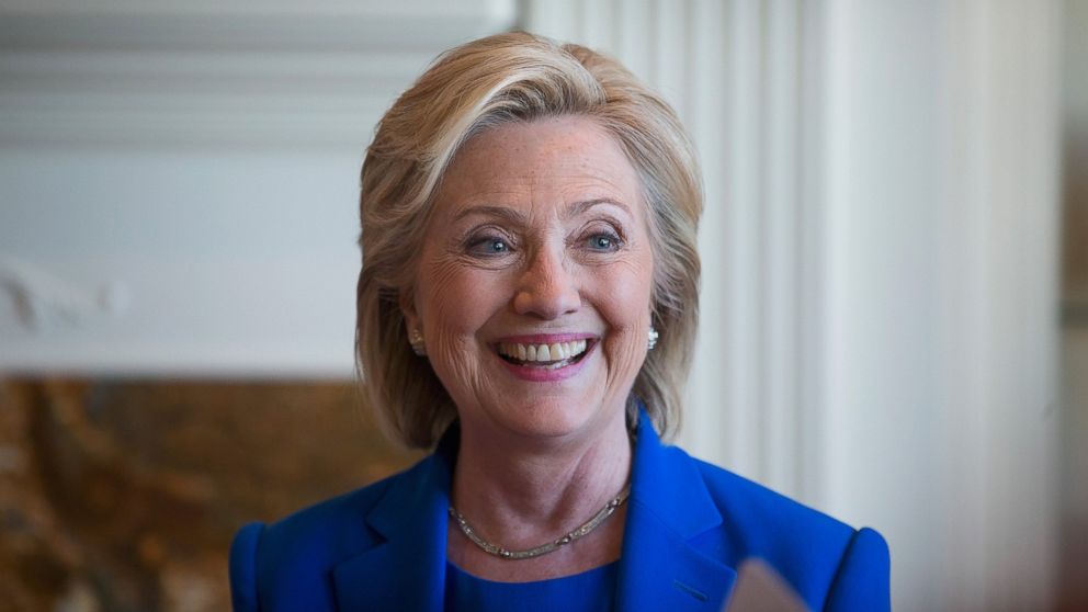 Democratic Presidential candidate Hillary Clinton chats with supporters during a campaign stop at the home of Chuck and Linda Smoley on June 13, 2015 in Sioux City, Iowa. 