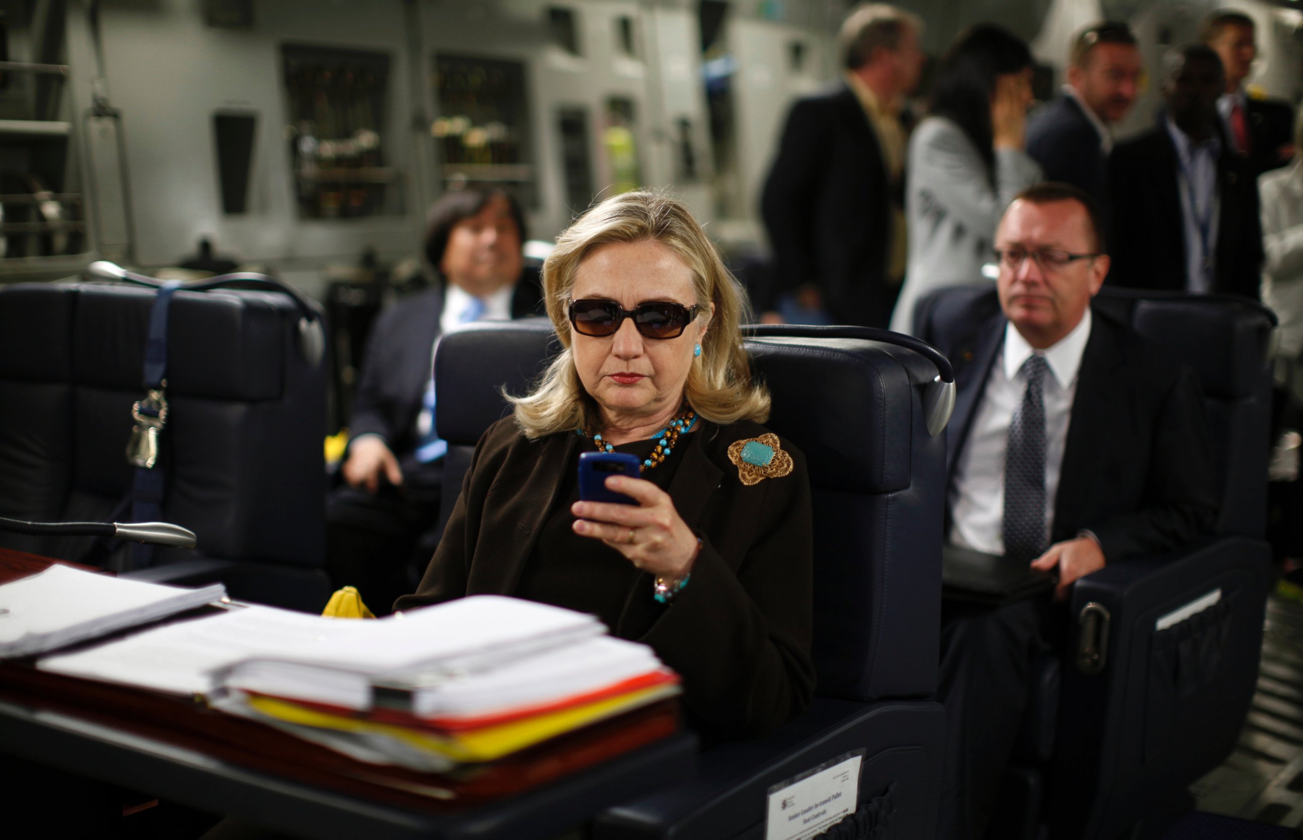 PHOTO: U.S. Secretary of State Hillary Clinton checks her PDA upon departure in a military C-17 plane from Malta bound for Tripoli, Oct. 18, 2011.