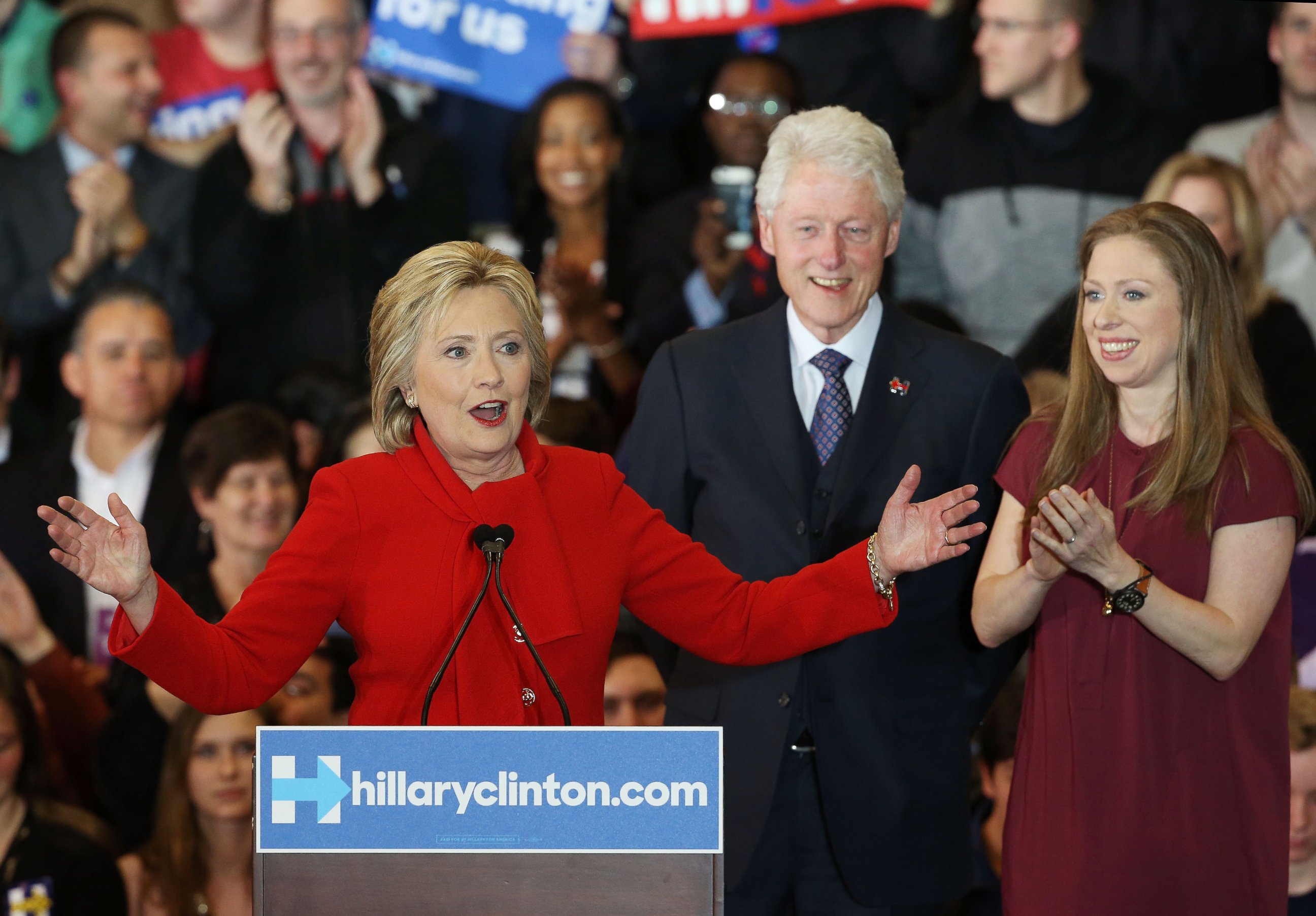PHOTO: Democratic presidential candidate Hillary Clinton speaks to supporters as former President Bill Clinton and daughter Chelsea Clinton look on during her caucus night event in the Olmsted Center at Drake University, Feb. 1, 2016 in Des Moines, Iowa. 