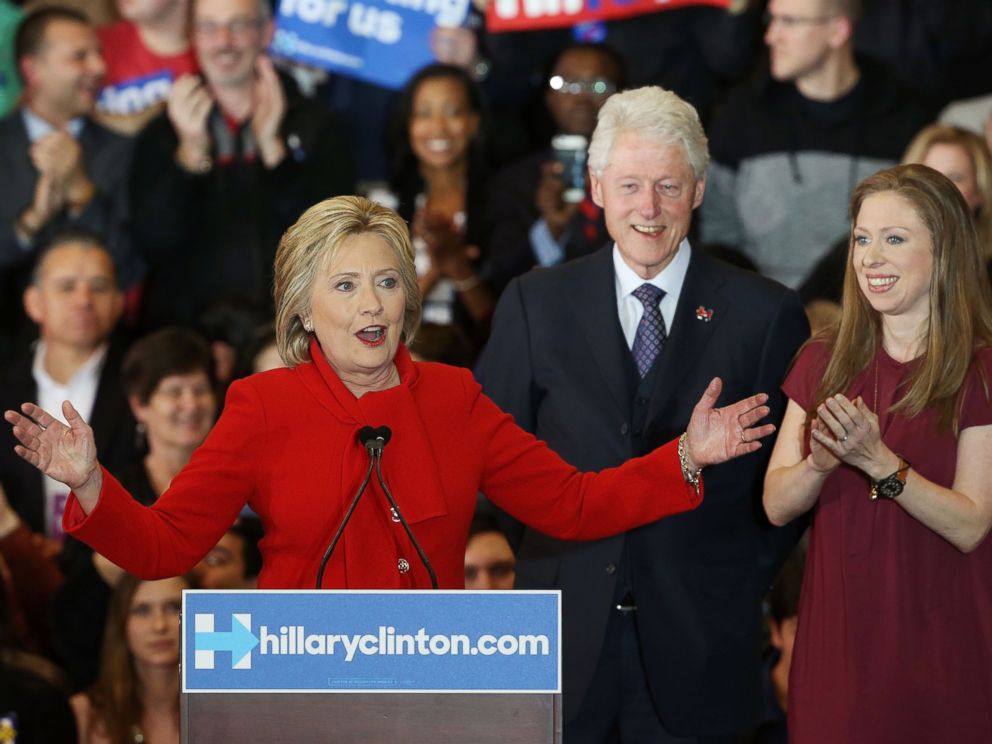 PHOTO: Democratic presidential candidate Hillary Clinton speaks to supporters as former President Bill Clinton and daughter Chelsea Clinton look on during her caucus night event in the Olmsted Center at Drake University, Feb. 1, 2016 in Des Moines, Iowa.