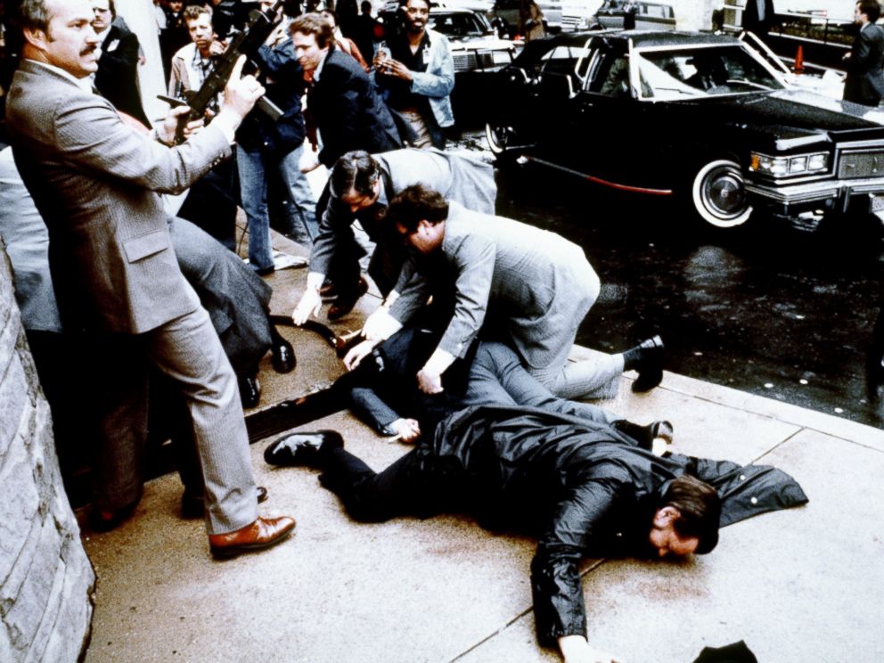 PHOTO: This photo taken by presidential photographer Mike Evens on March 30, 1981 shows police and Secret Service agents reacting during the assassination attempt on then US president Ronald Reagan, after a conference in Washington, D.C.