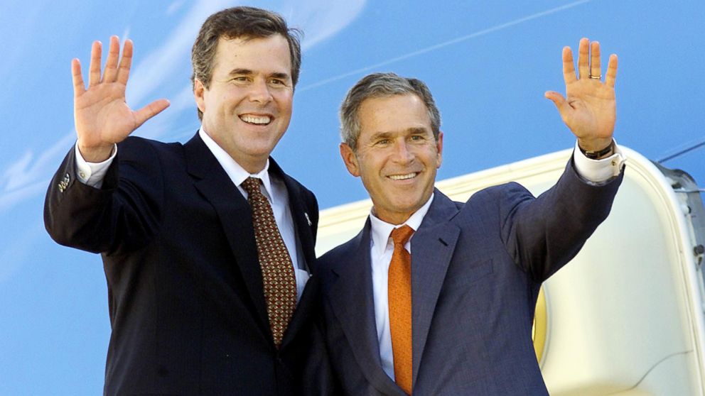 Florida Governor Jeb Bush, left, and his brother President George W. Bush wave from atop the stairs to Air Force One shortly after a reading event for students at Justina Elementary School in Jacksonville, Fla., Sept. 9, 2001.    