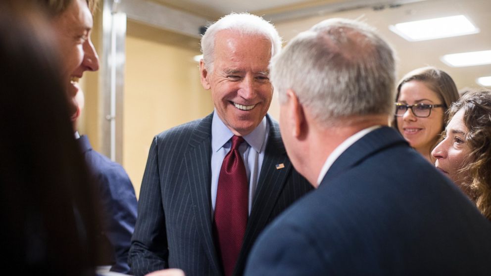 Vice President Joe Biden stops to speak with Sen. Lindsey Graham, R-S.C., as he heads to the Senate subway, March 25, 2015. 