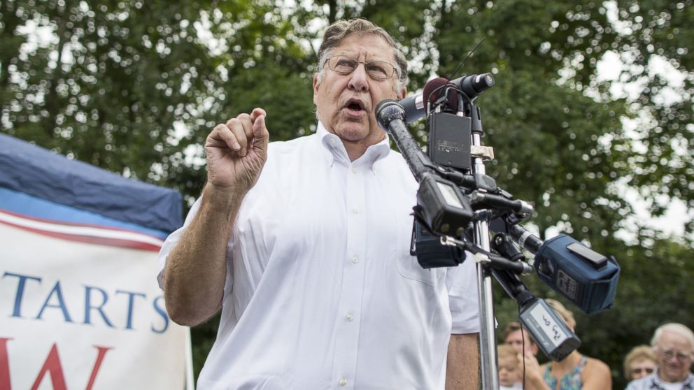 Former New Hampshire Governor John H. Sununu introduces Texas Governor Rick Perry during a GOP event, Aug. 23, 2014 in Stratham, N.H. 