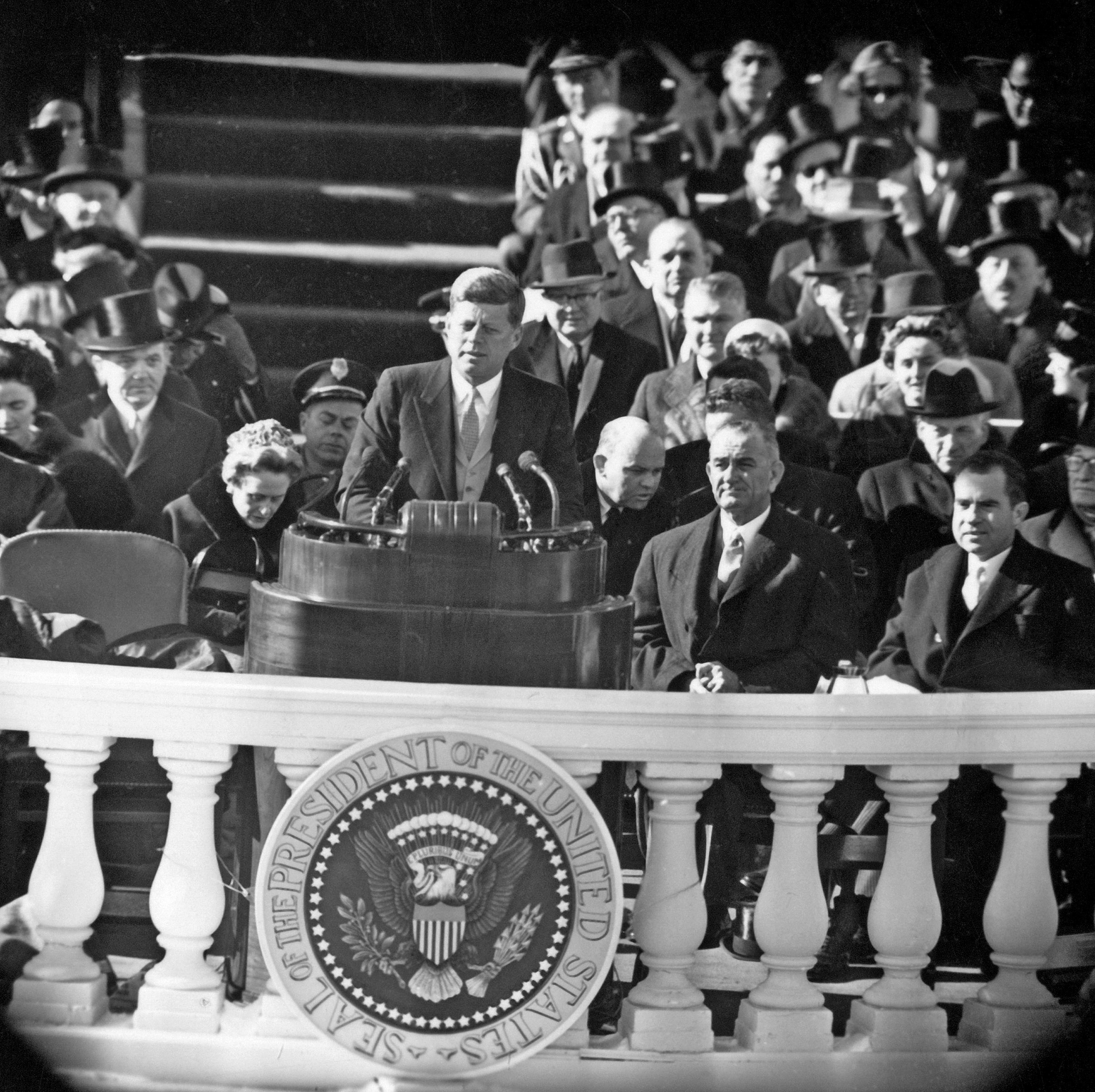 PHOTO: John F. Kennedy delivers his inauguration address, Jan. 20, 1961. Seated behind him are Lyndon B. Johnson and Richard Nixon, the man he defeated.
