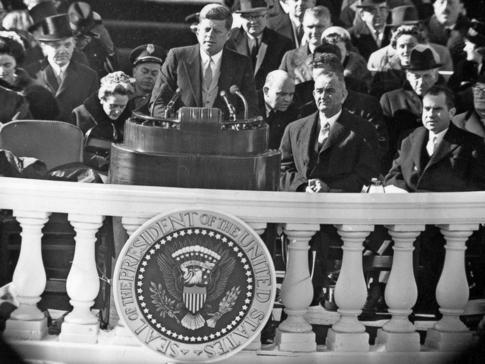 PHOTO: John F. Kennedy delivers his inauguration address, Jan. 20, 1961. Seated behind him are Lyndon B. Johnson and Richard Nixon, the man he defeated.