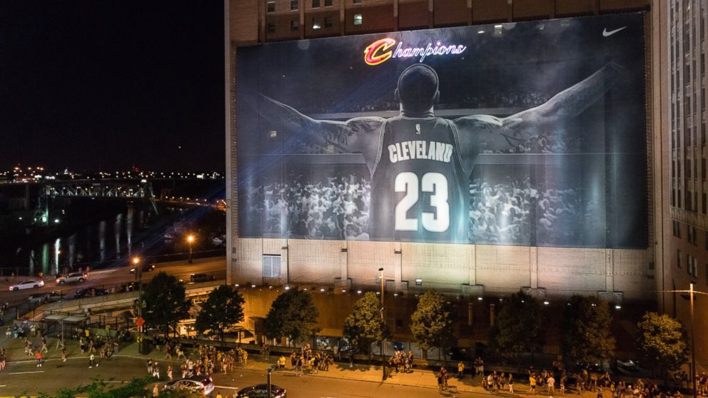 Fans react in downtown Cleveland after the Cleveland Cavaliers won the NBA Championship, June 19, 2016, in Cleveland, Ohio.