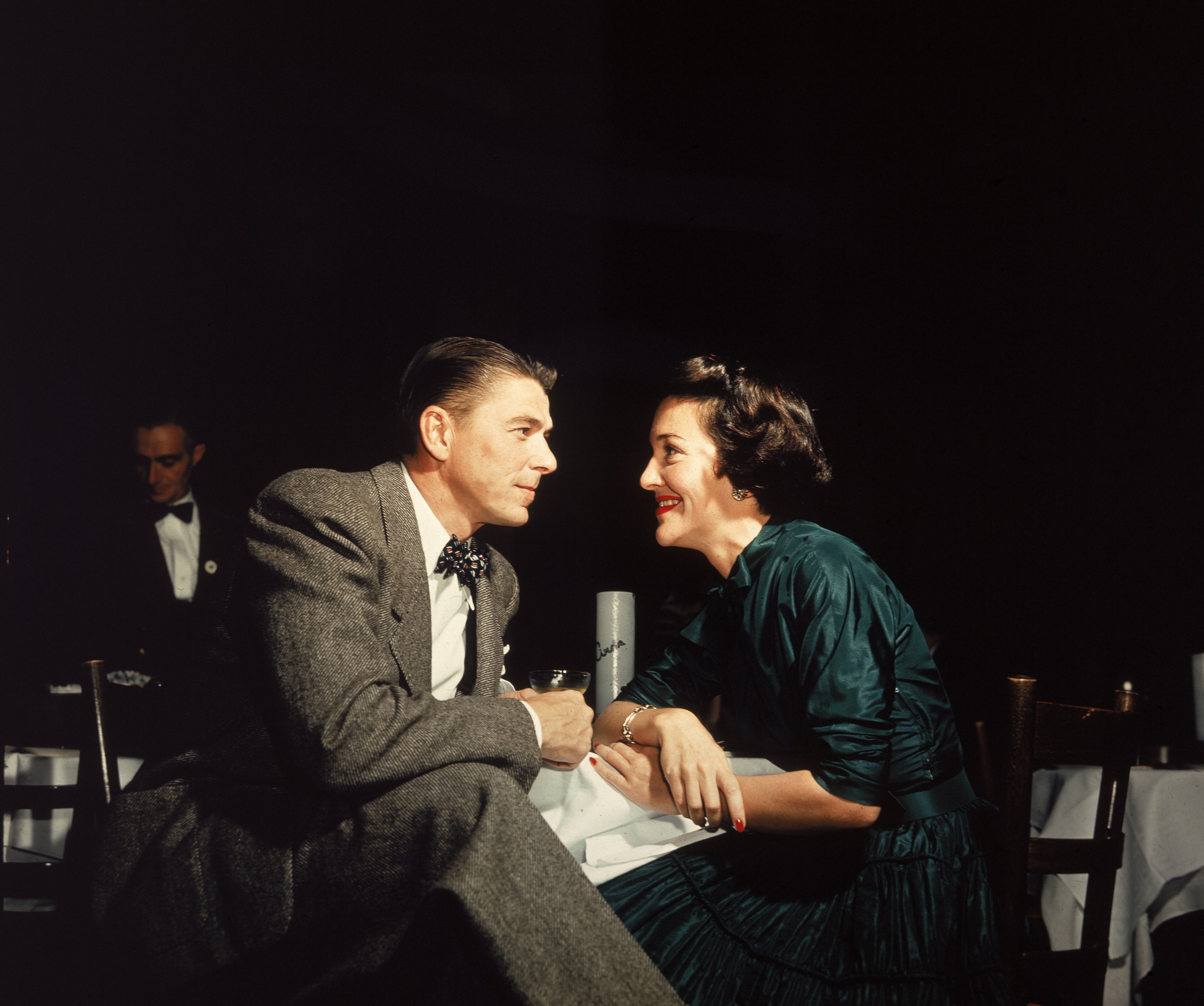 PHOTO:Ronald Reagan and Nancy Reagan gaze at one another across a table, circa 1952. 