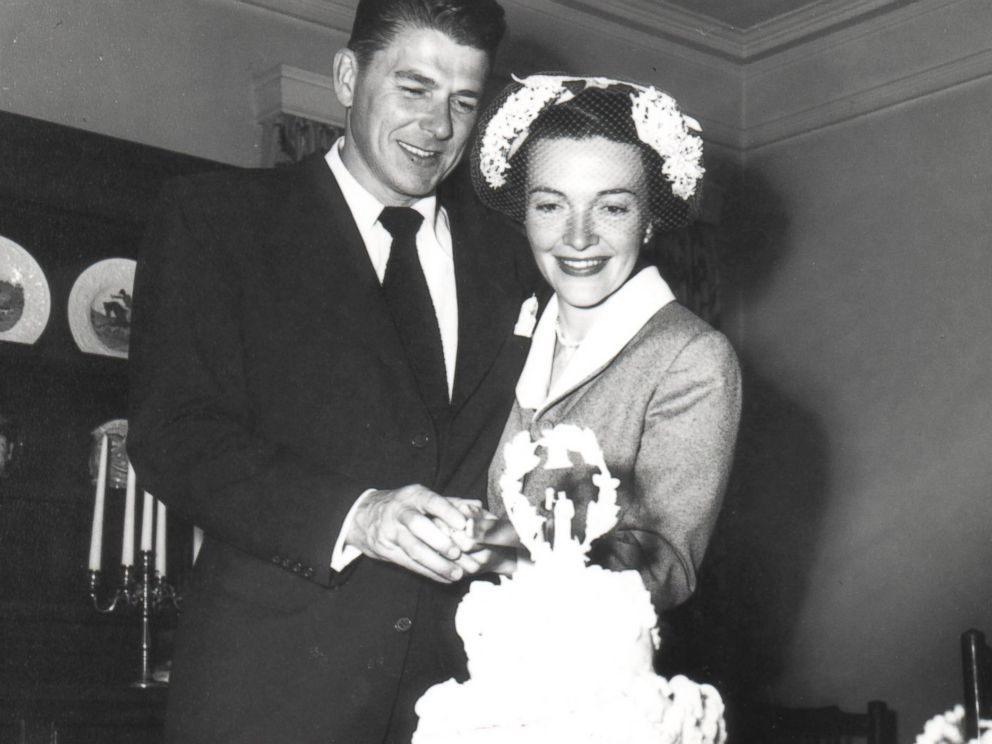 PHOTO:Ronald and Nancy Reagan cutting cake following their wedding ceremony.