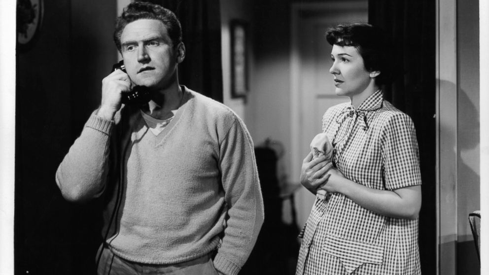 PHOTO:James Whitmore on the phone as Nancy Davis watches in a scene from the film 'The Next Voice You Hear...', 1950.  