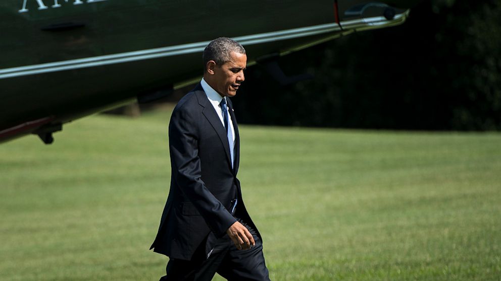 President Barack Obama walks from Marine One on the South Lawn of the White House, July 30, 2013, in Washington. 