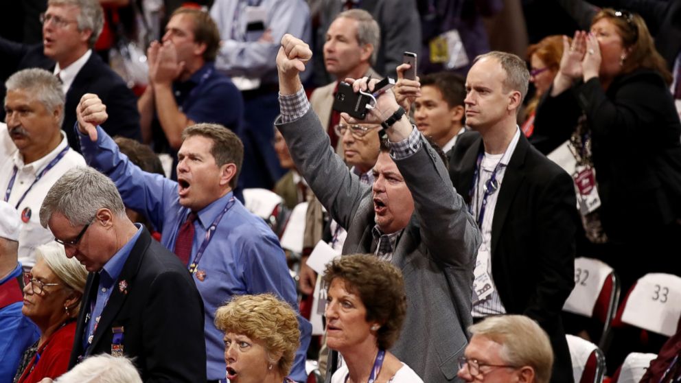 Delegates protest on the floor during on the first day of the Republican National Convention, July 18, 2016, at the Quicken Loans Arena in Cleveland, Ohio. 
