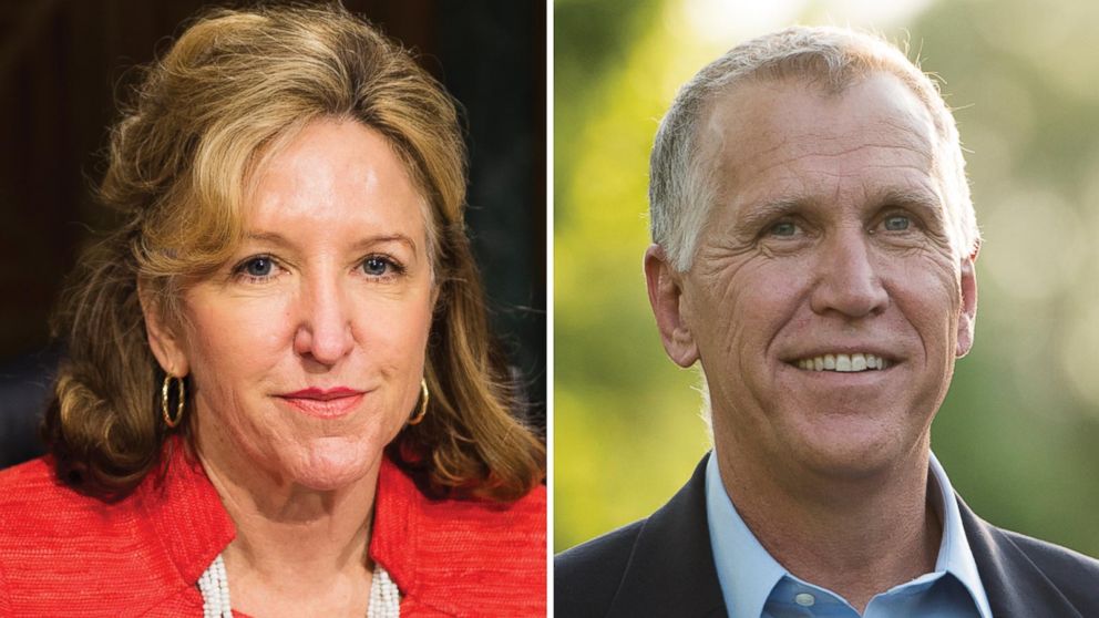 Sen. Kay Hagan, D-N.C., left, takes her seat for the Senate Banking, Housing and Urban Affairs Committee hearing in this July 15, 2014, file photo; right, N.C. Speaker of the House and GOP Senate candidate Thom Tillis knocks on doors in an upscale Huntersville, N.C., neighborhood north of Charlotte May 5, 2014. 