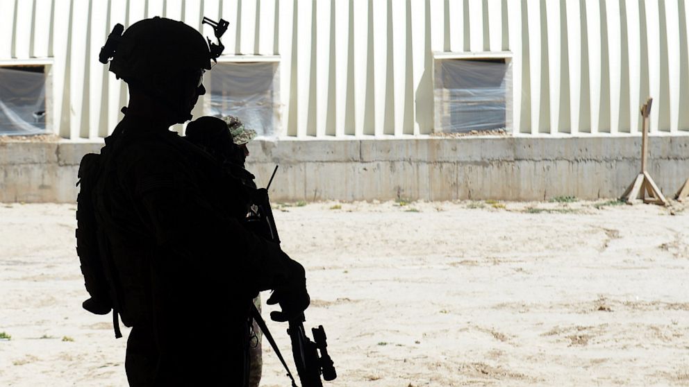 A soldier from the 10 Mountain Division US Army 2nd Battalion 22nd Infantry Regiment stands guard at the Afghan National Army(ANA) Forward Operating Base Muqor in Ghazni province, May 28, 2013.