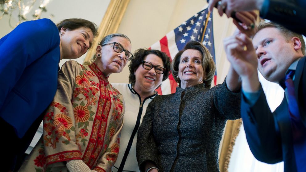 House Minority Leader Nancy Pelosi, D-Calif., right, prepares to take a picture in her Capitol office with Supreme Court Justices, from left, Elena Kagan, Ruth Bader Ginsburg, and Sonia Sotomayor, before a reception in Washington, March 18, 2015.