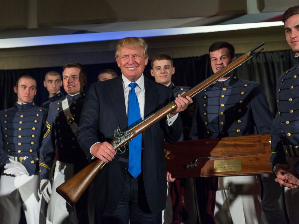 PHOTO: Reality TV host and New York real estate mogul Donald Trump holds up a replica flintlock rifle awarded him by cadets during the Republican Society Patriot Dinner at the Citadel Military College, Feb. 22, 2015 in Charleston, S.C.