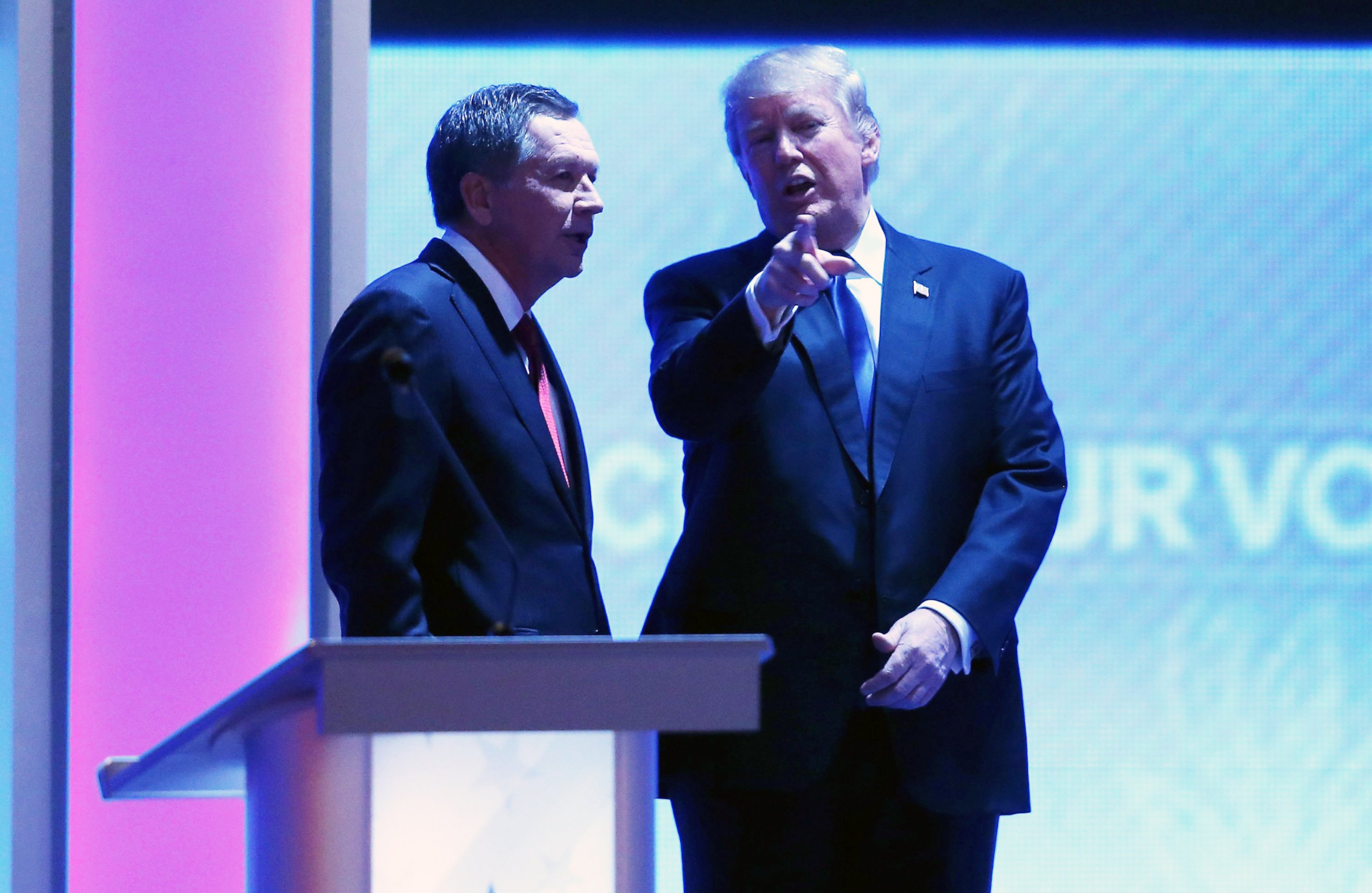 PHOTO:John Kasich and Donald Trump talk during a commercial break at the Republican presidential debate at St. Anselm College, Feb. 6, 2016, in Manchester, N.H.   