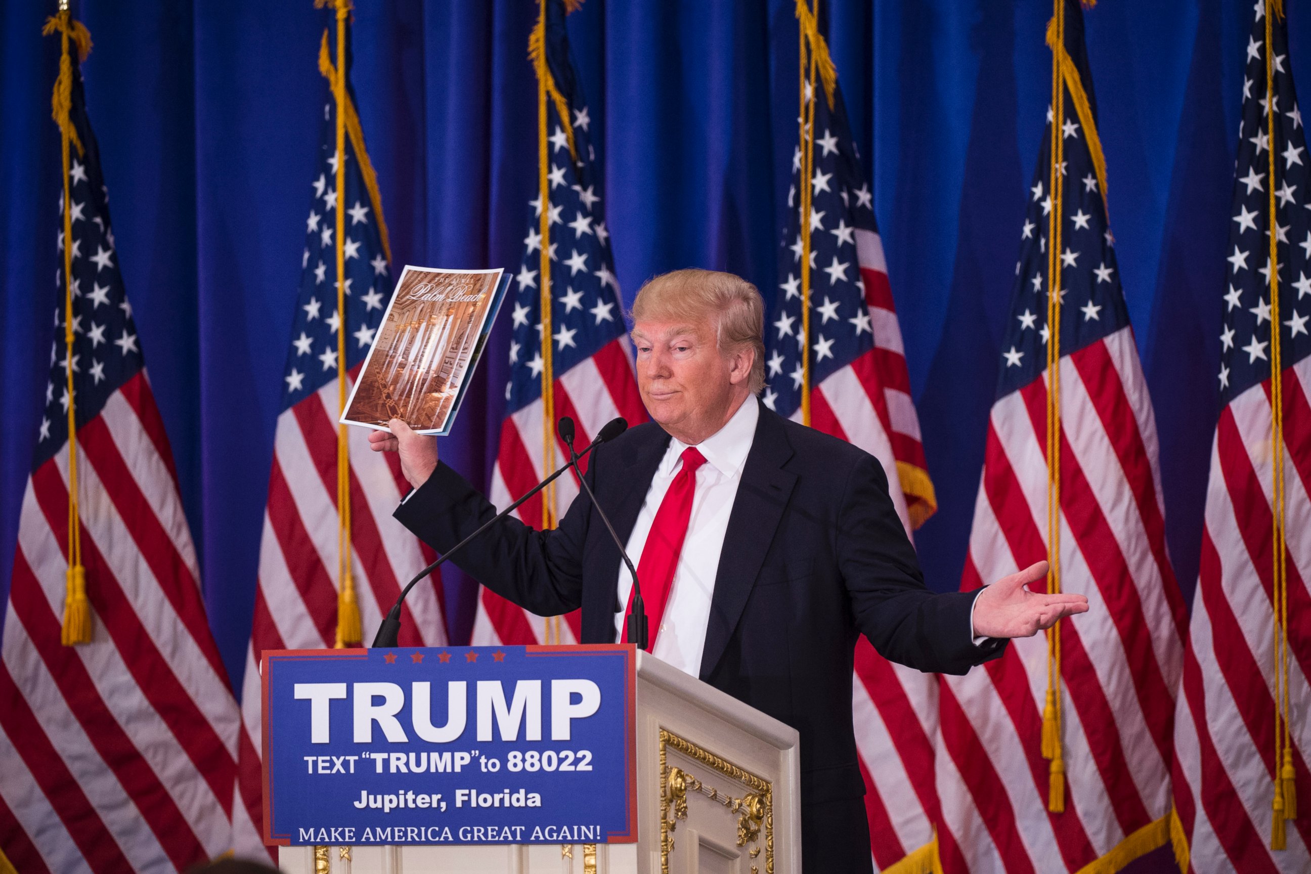 PHOTO:Donald Trump shows of his magazine as he speaks during a campaign press conference event at the Trump National Golf Club in Jupiter, Fla., March 08, 2016. 