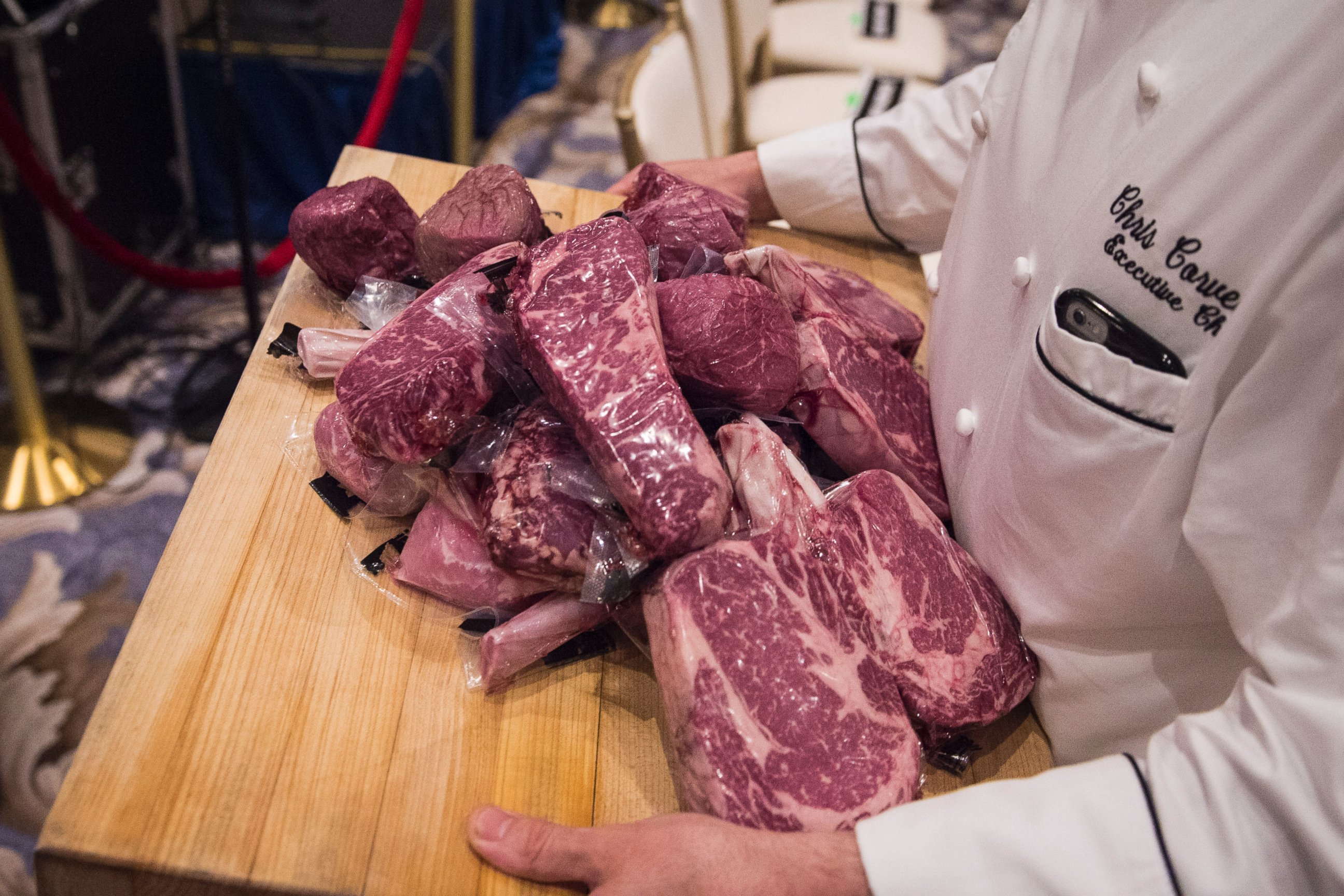 PHOTO:A workers carries Trump branded steaks back to the kitchen before Donald Trump speaks at a campaign press conference event at the Trump National Golf Club in Jupiter, Fla., March 08, 2016.  