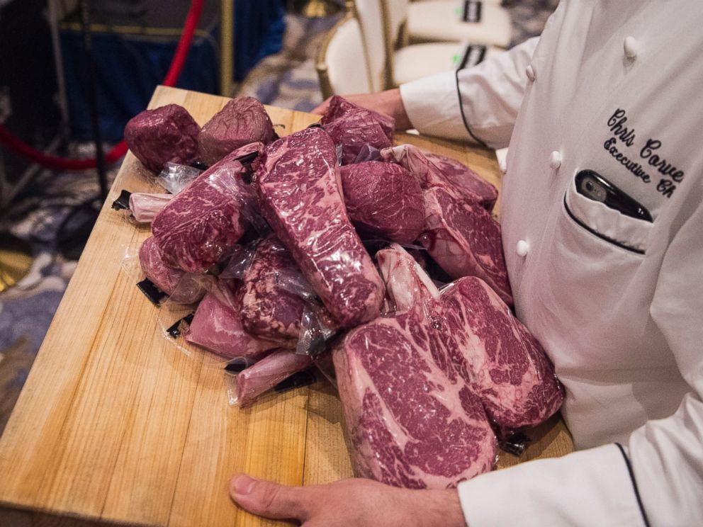 PHOTO:A workers carries Trump branded steaks back to the kitchen before Donald Trump speaks at a campaign press conference event at the Trump National Golf Club in Jupiter, Fla., March 08, 2016.