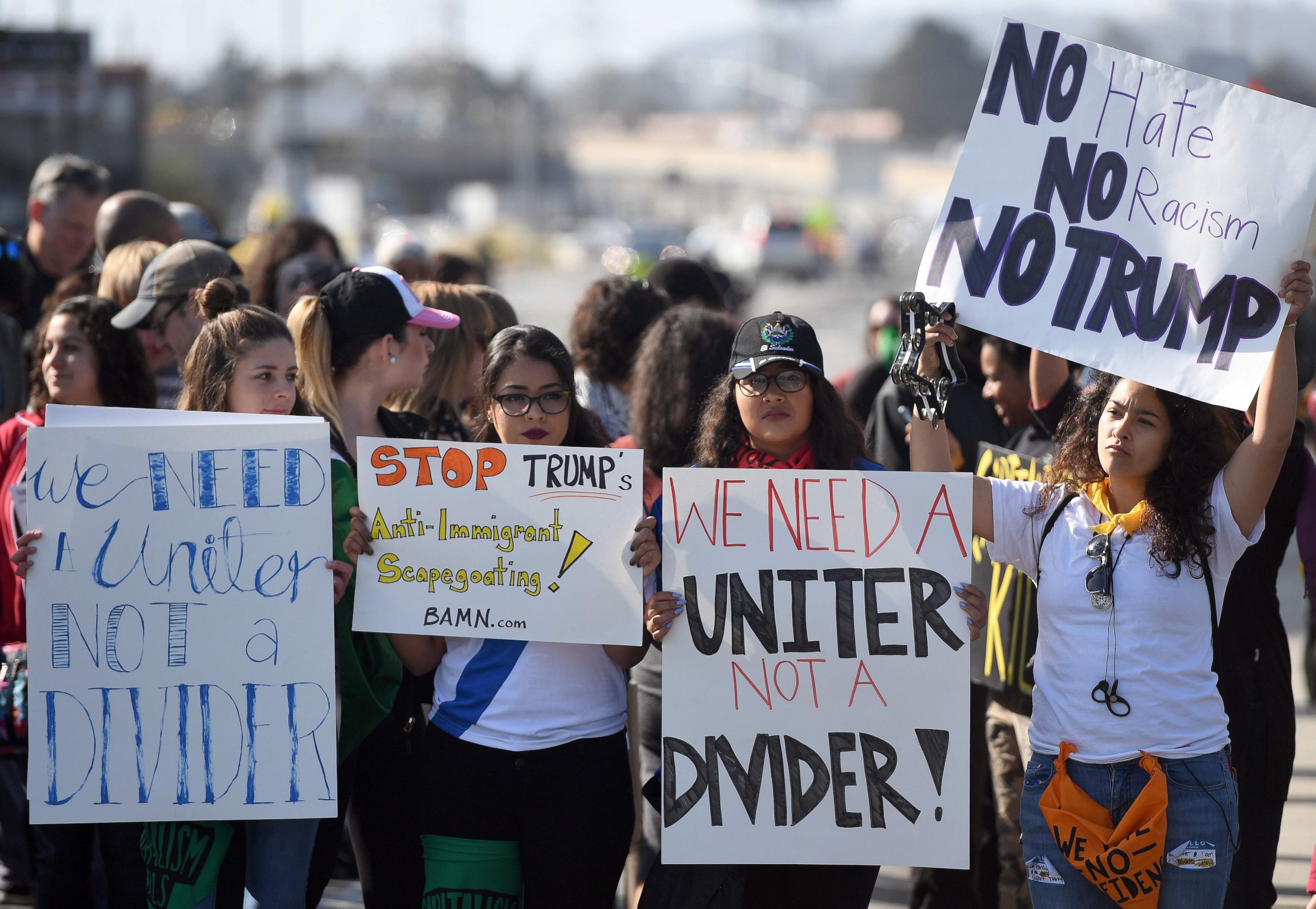 PHOTO: Protesters hold up signs during a rally against Donald Trump in Burlingame, California, April 29, 2016.