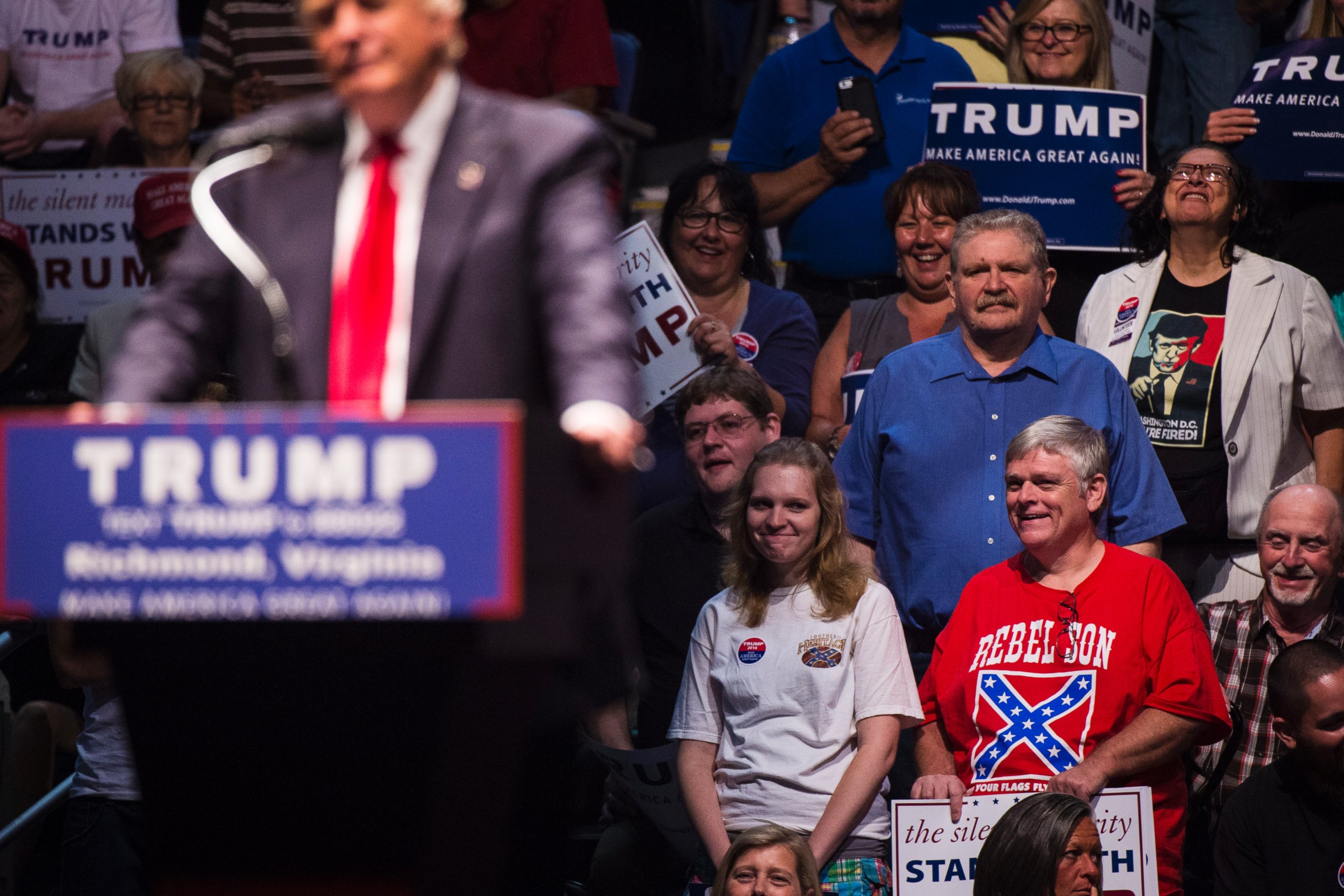 PHOTO: A man wears a shirt with a confederate flag on it as Republican presidential candidate Donald Trump speaks during a rally at the Richmond Coliseum in Richmond, Virginia, June 10, 2016. 
