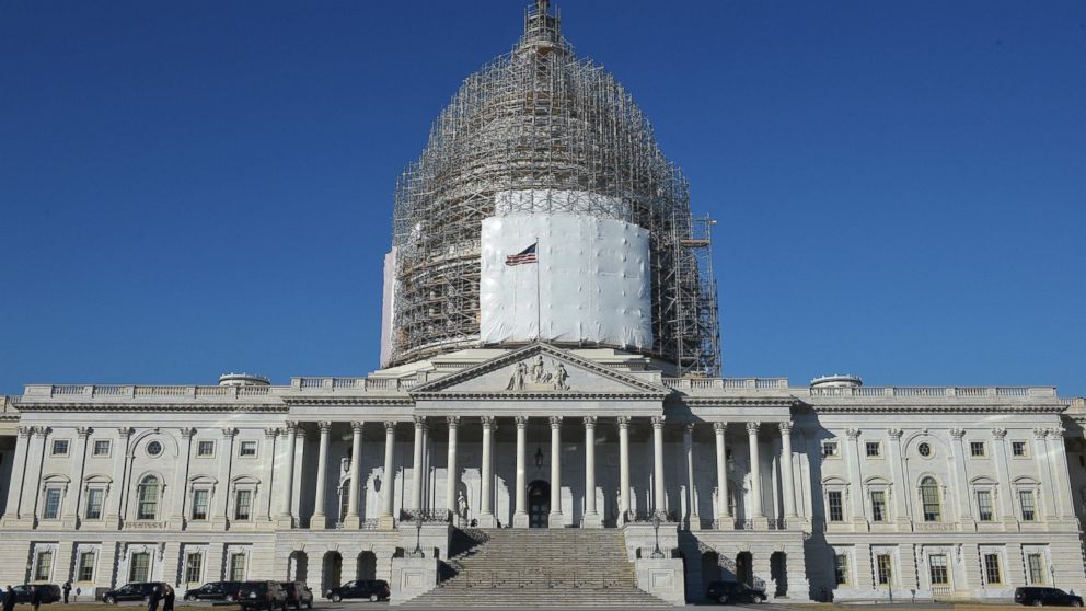 The U.S. Capitol is shown with its dome encased in scaffolding as it undergoes renovation in Washington, Feb. 11, 2015. 
