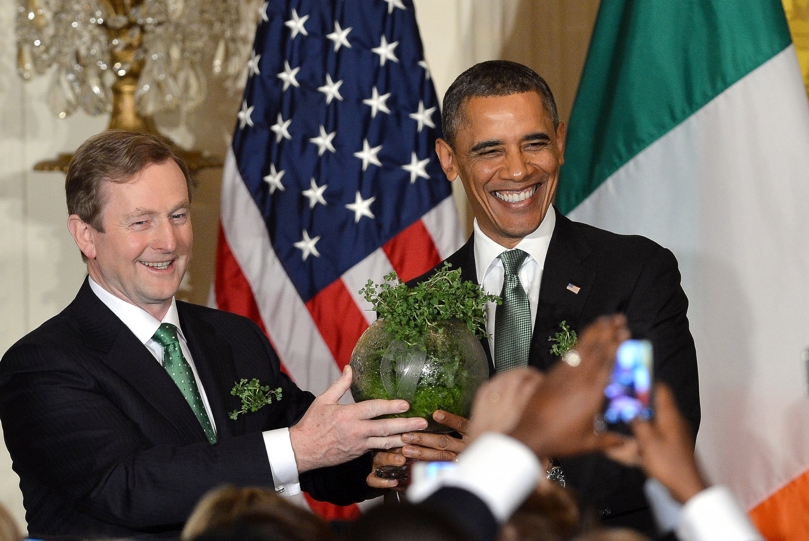 PHOTO: Irish Prime Minister Enda Kenny presents  a bowl of shamrock to President Barack during a St. Patrick's Day reception in the East Room at the White House in Washington, March 19, 2013.