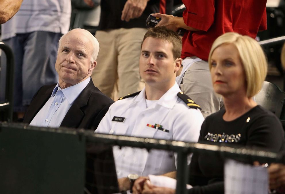 PHOTO: U.S. Sen. John McCain (R-AZ), U.S. Navy ensign Jack McCain and wife Cindy McCain attend the major league baseball game between the San Diego Padres and the Arizona Diamondbacks at Chase Field on May 25, 2009 in Phoenix, Arizona.