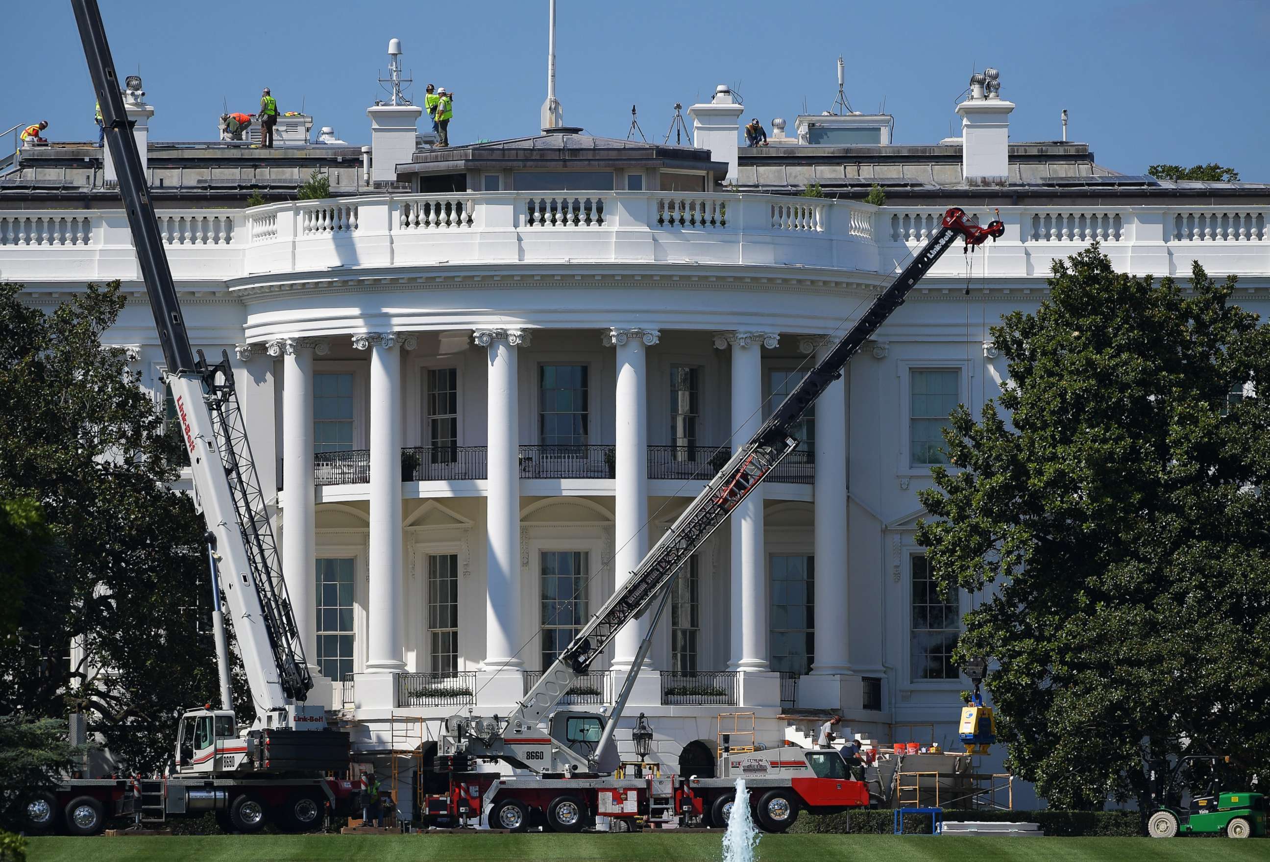 PHOTO: Cranes are seen infront of the south front of the White House as it undergoes renovations on August 9, 2017 in Washington, DC. 