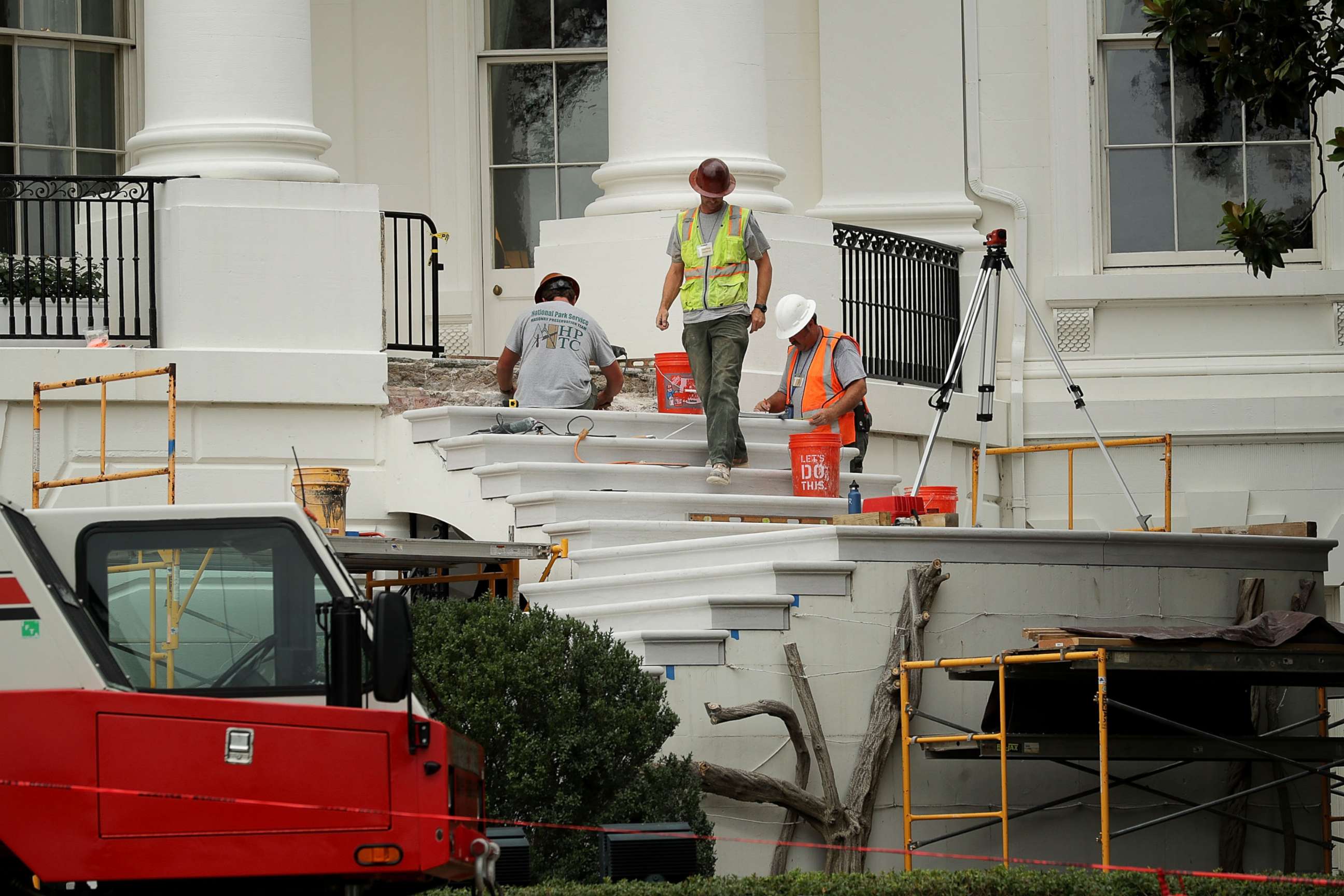 PHOTO: Workers repair the South Portico steps, part of a large renovation project at the White House August 11, 2017 in Washington, DC. 