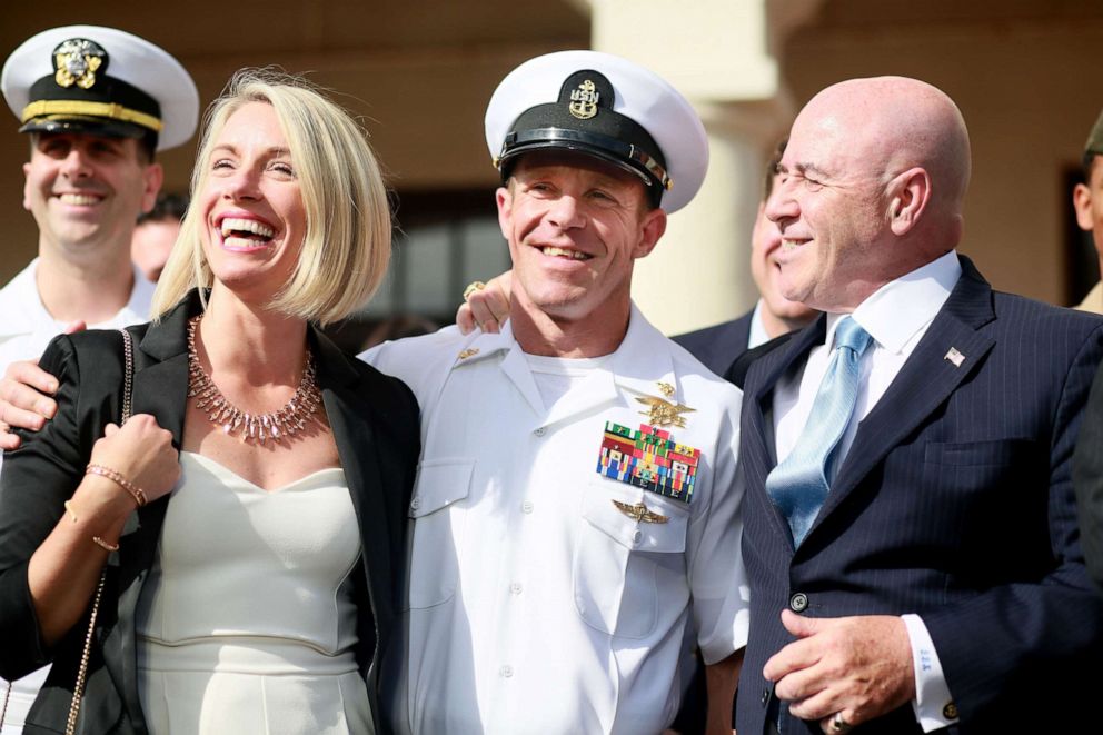 PHOTO: Navy Special Operations Chief Edward Gallagher celebrates with his wife Andrea after being acquitted of premeditated murder at Naval Base San Diego. July 2, 2019, in San Diego, Calif.