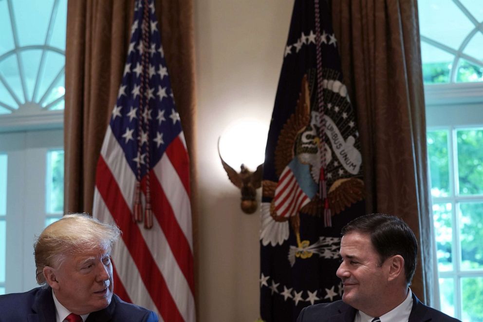 PHOTO: U.S. President Donald Trump (L) talks to Arizona Gov. Doug Ducey (R) during a working lunch with governors at the White House June 13, 2019 in Washington, DC. (Photo by Alex Wong/Getty Images)